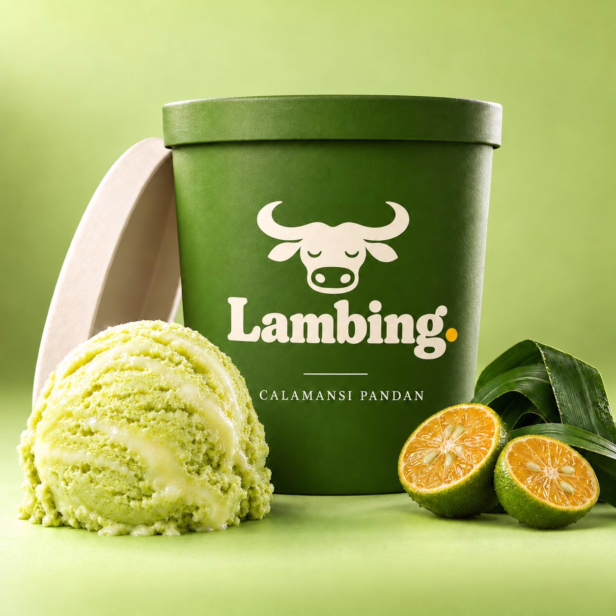 A pint of calamansi and pandan sorbet with halved calamansi