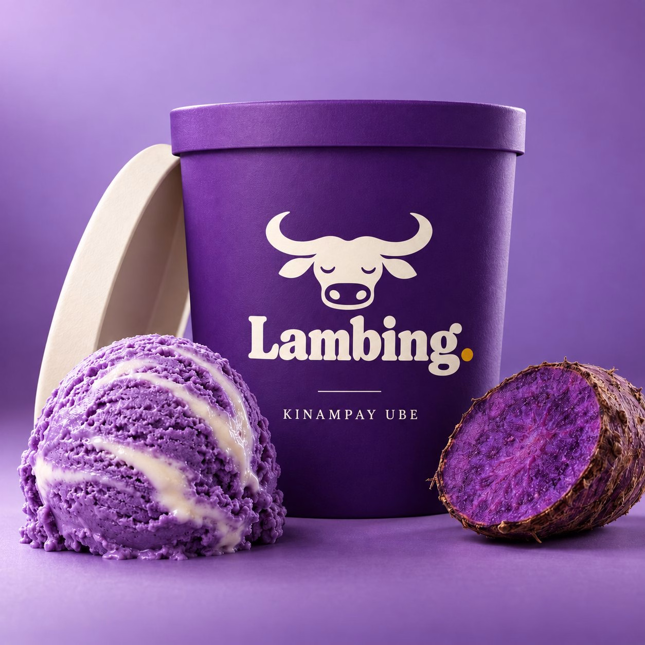 A pint of kinampay ube with a scoop and a halved ube